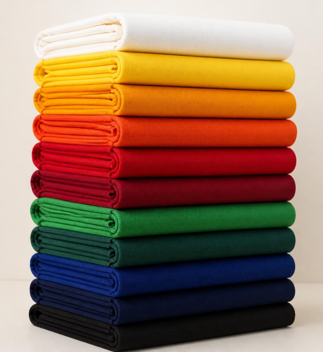 Stack of folded turban fabrics in many colours